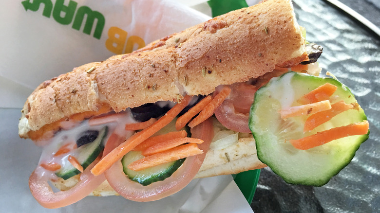 Close up of Subway sandwich on Subway packaging on table