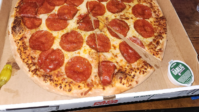 Papa John's pepperoni pizza with garlic dipping sauce