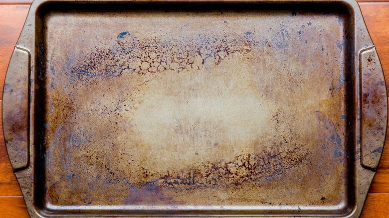 sheet pan covered in stains and burn marks