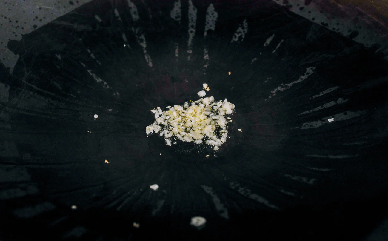 cooking chopped garlic in oil