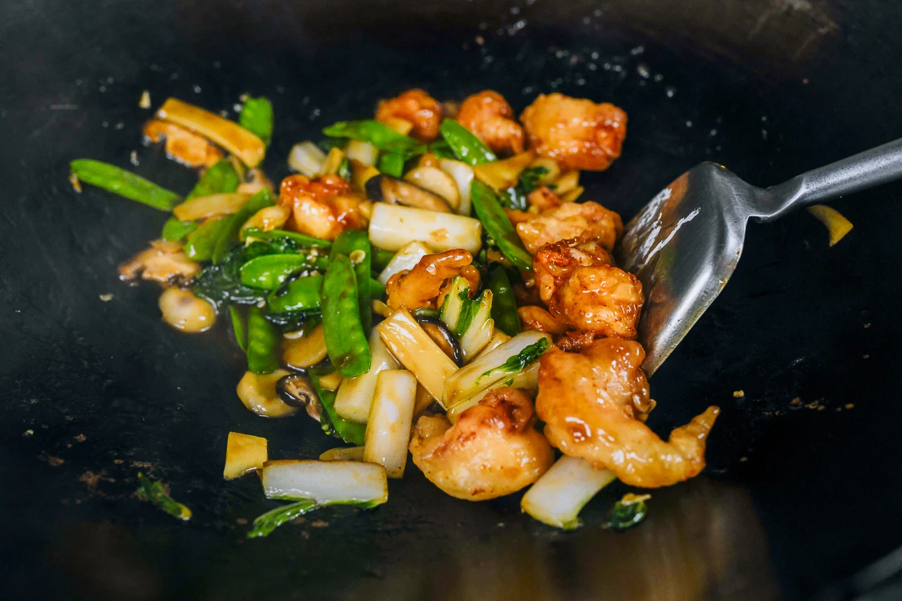 stir-frying chow har kew in wok