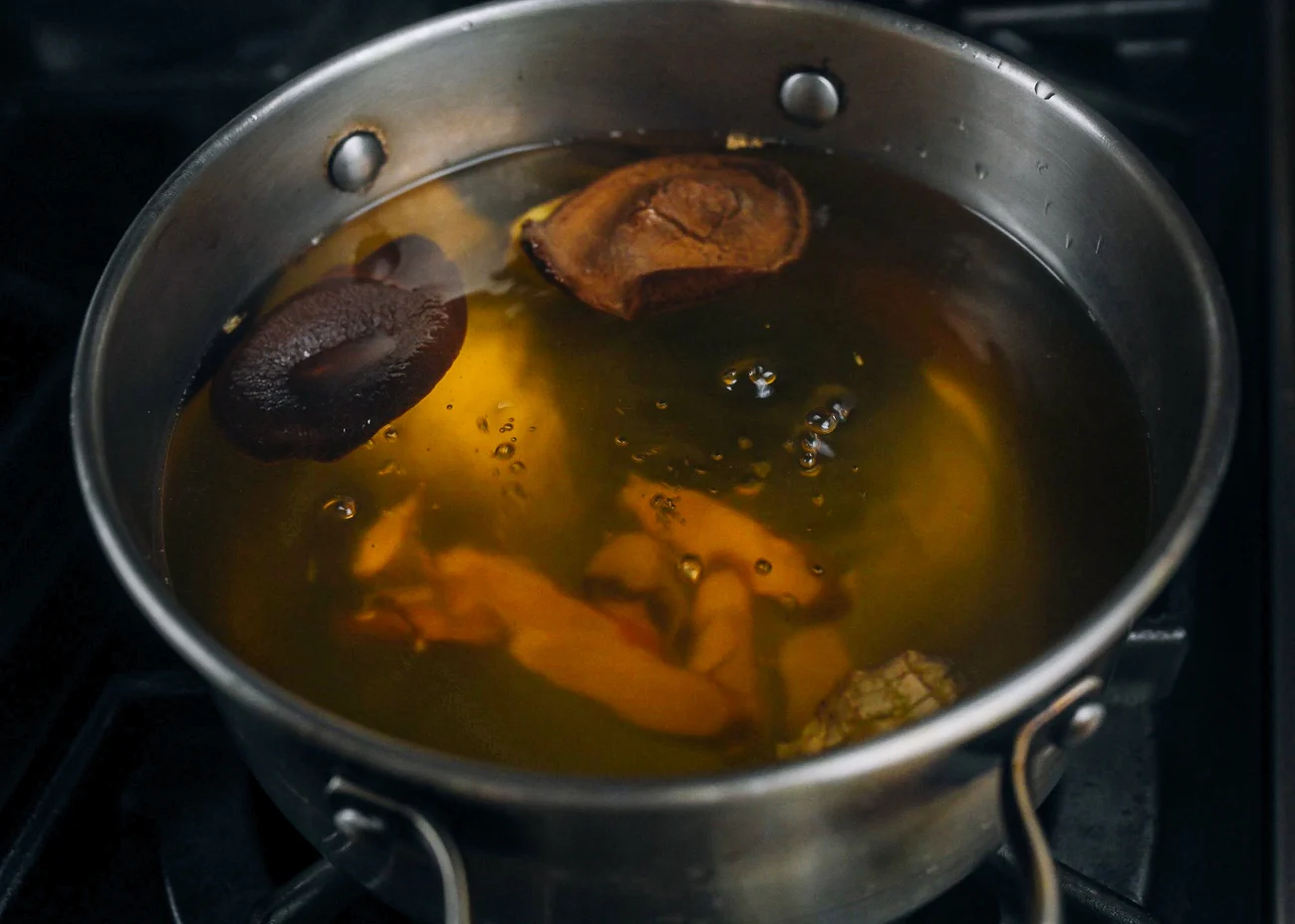 simmering orange peel, ginger, etc. in water