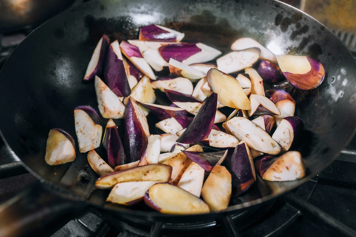 searing eggplant in wok