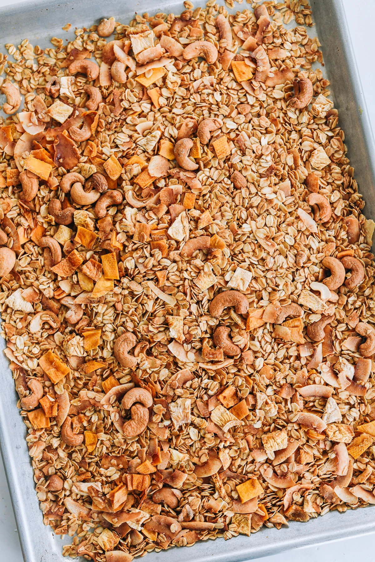 tropical granola on baking sheet