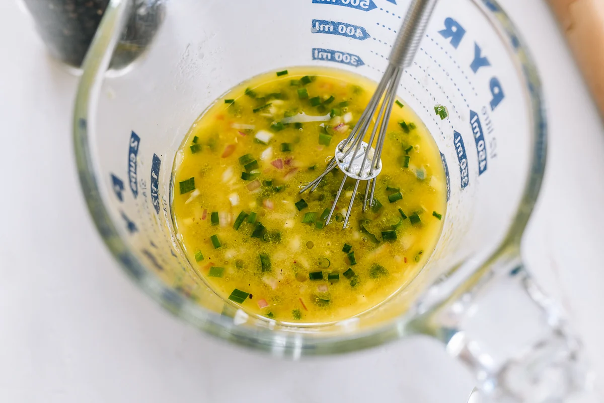 shallot vinaigrette in measuring cup