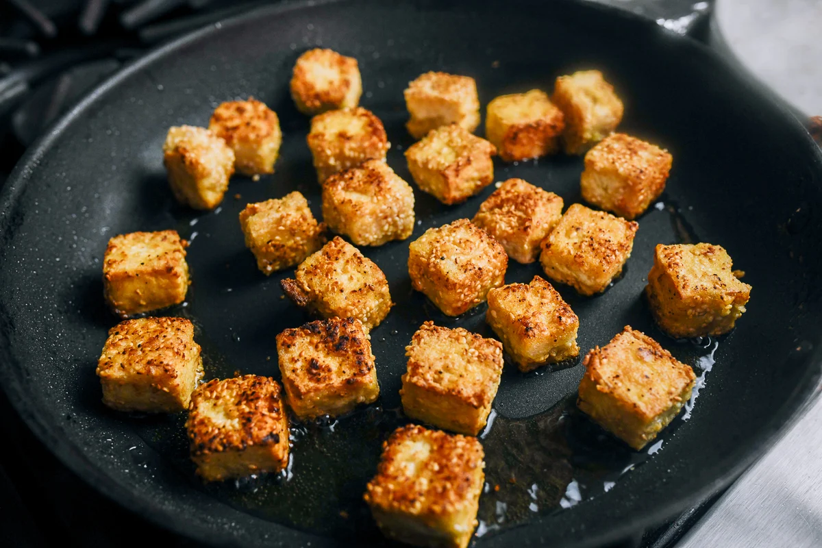 golden and crisp pan-fried cubes of tofu