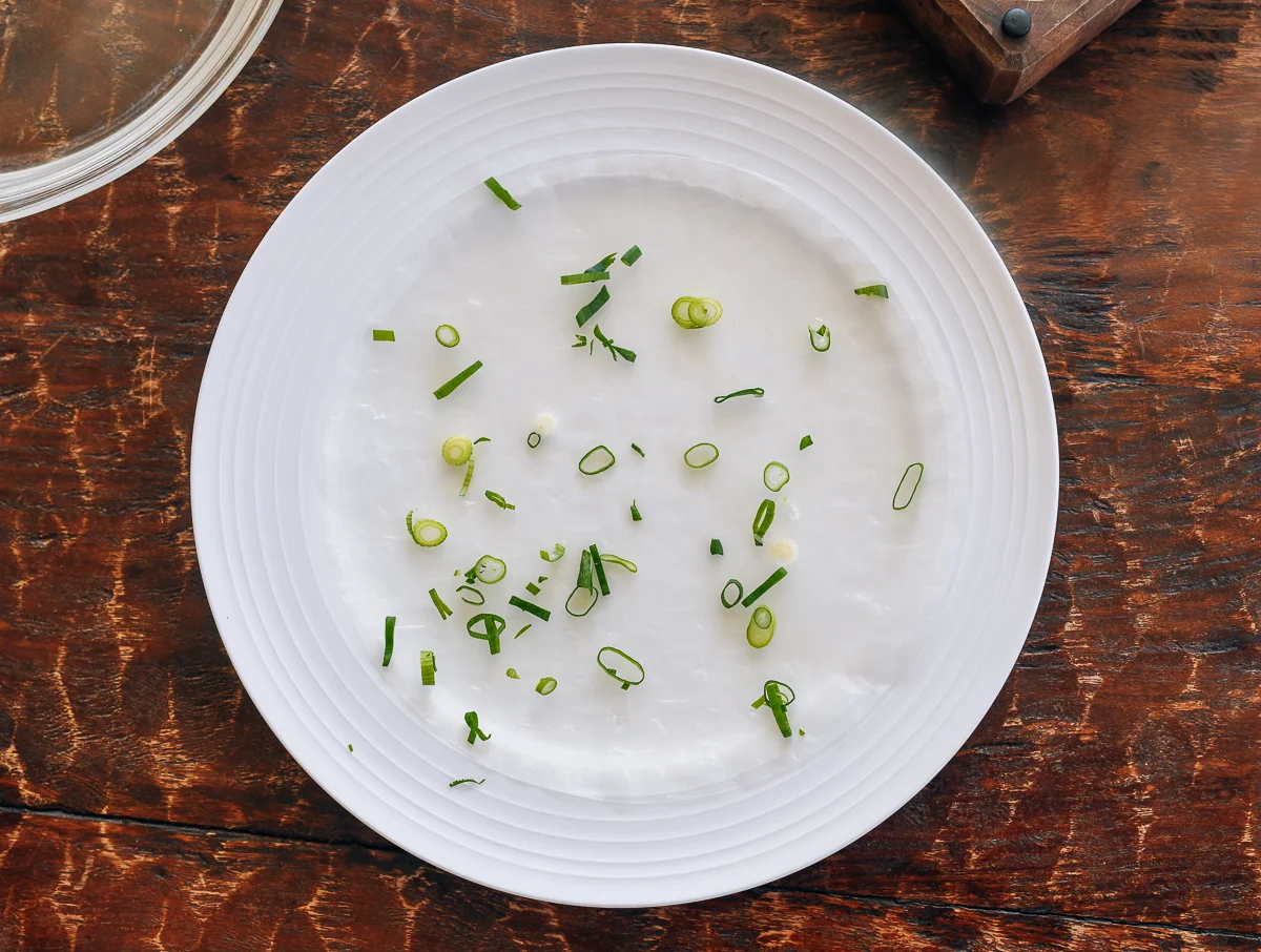rice paper wrapper with sprinkle of chopped scallion