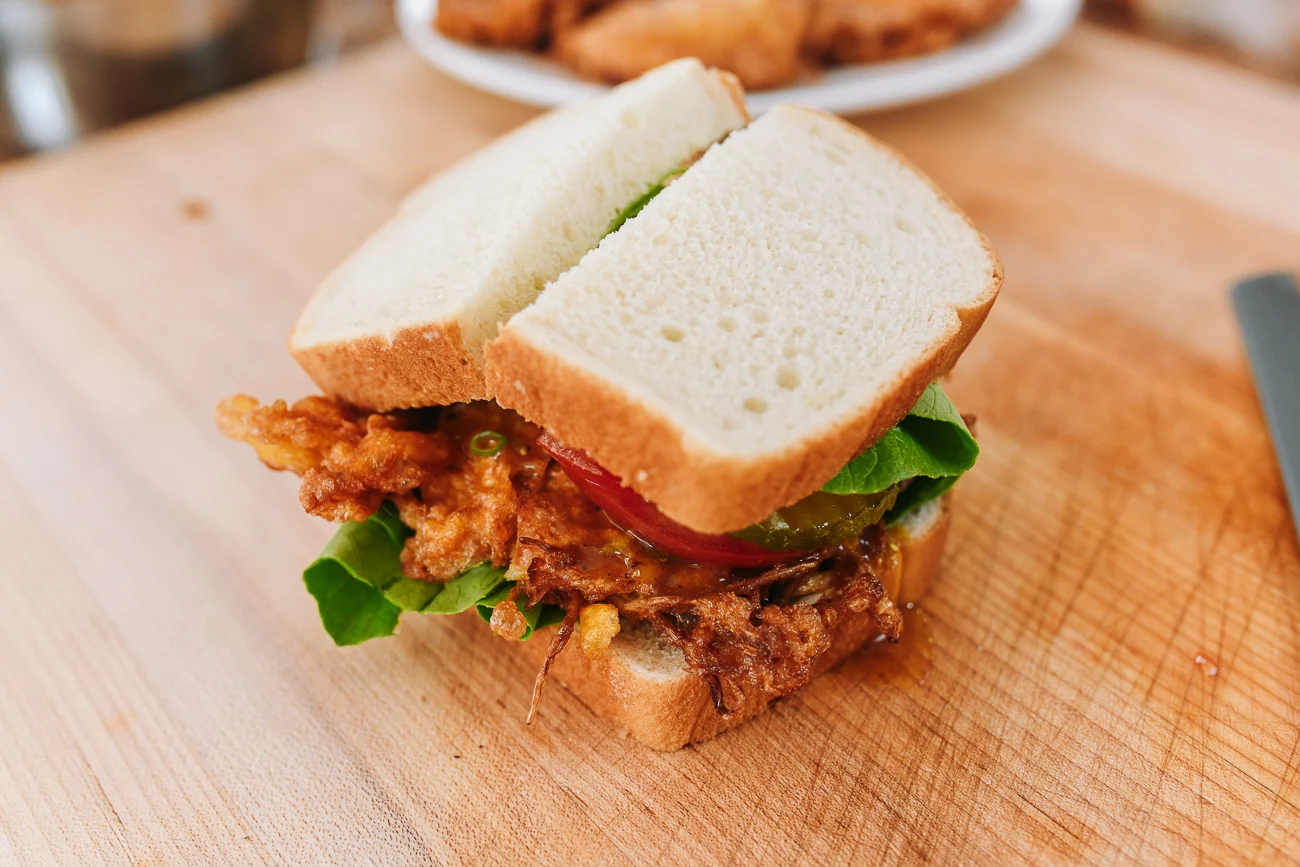 St. Paul Sandwich cut in half on cutting board