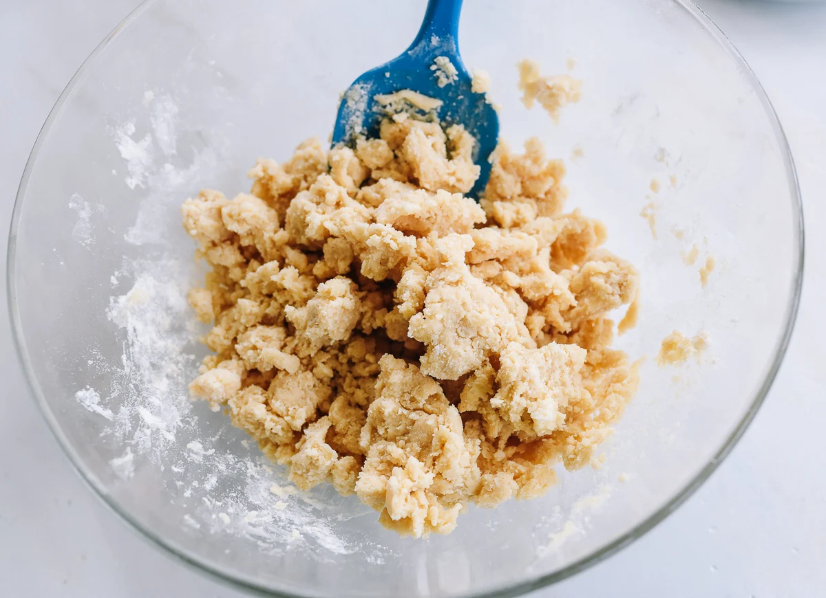 crumbly shortbread dough in glass bowl