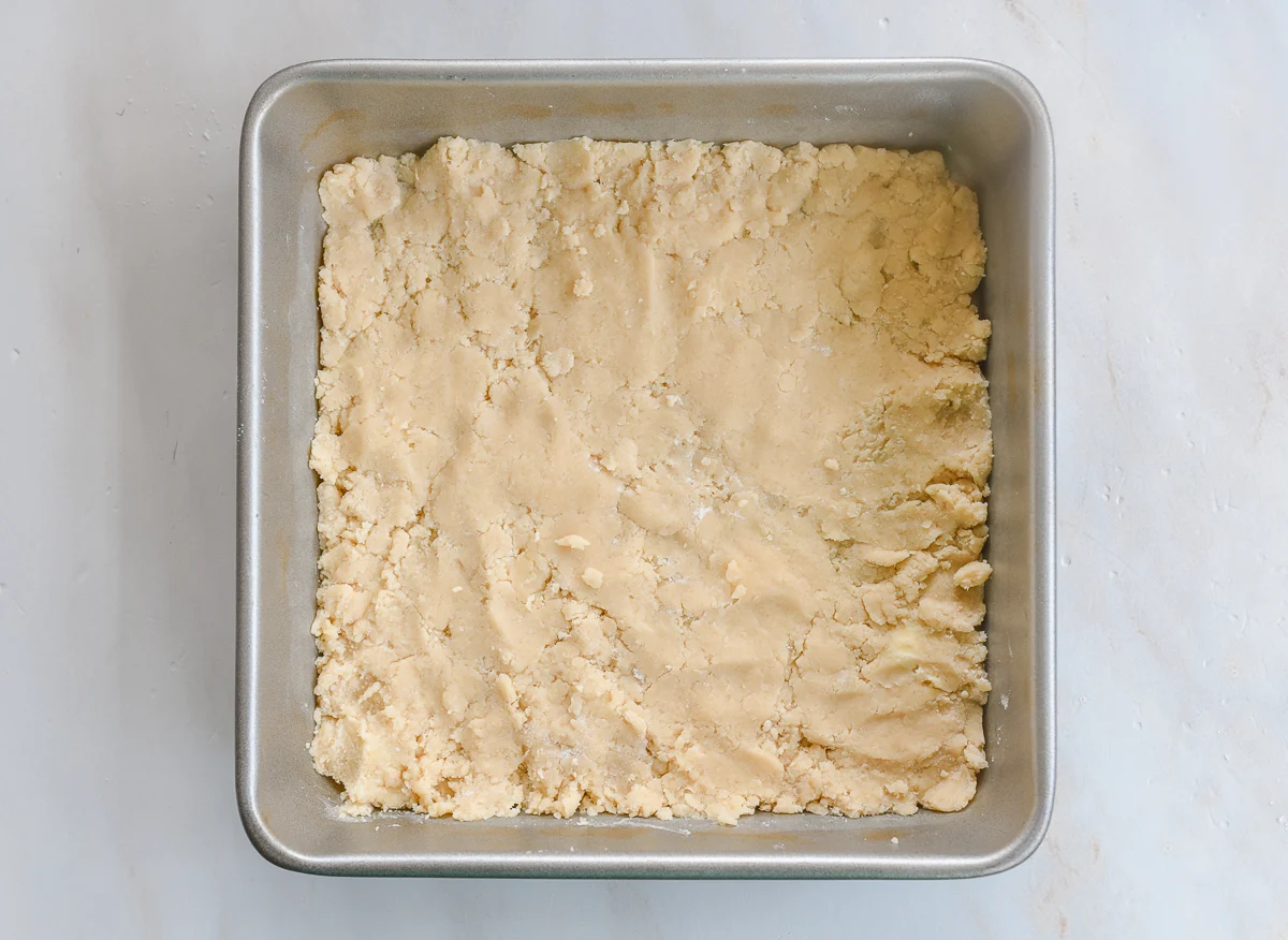 shortbread dough pressed into 9x9 inch square pan