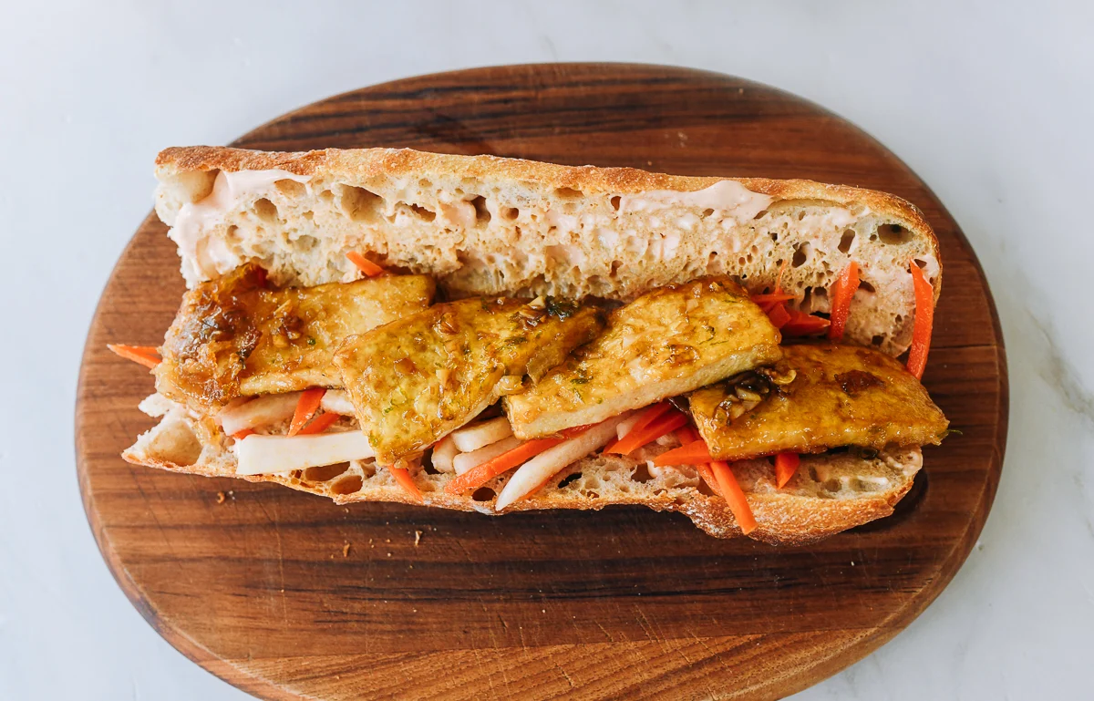 tofu and carrot daikon salad on baguette