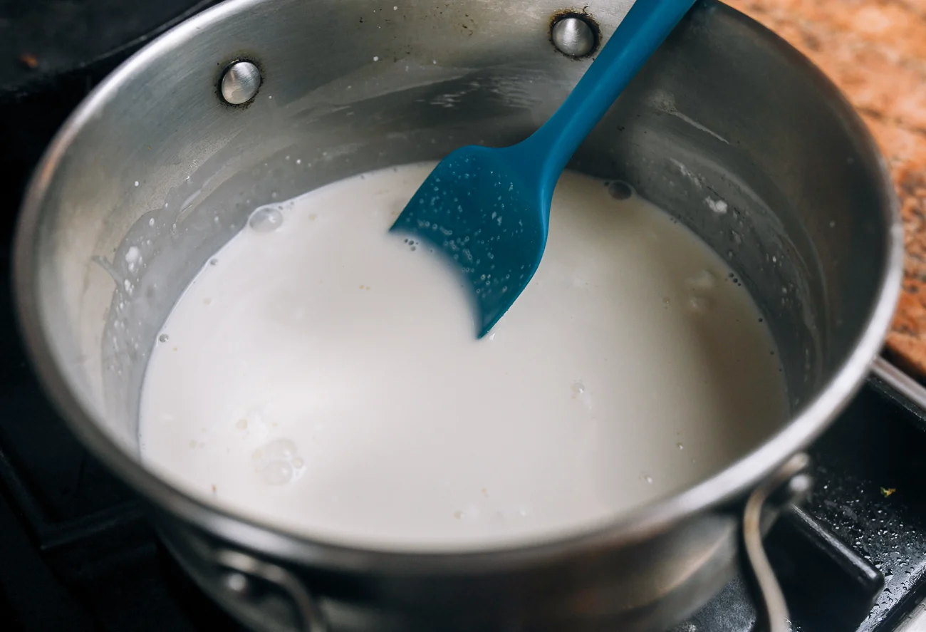 cooking milk and cornstarch in pot