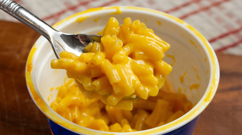 A spoon full of instant mac and cheese.