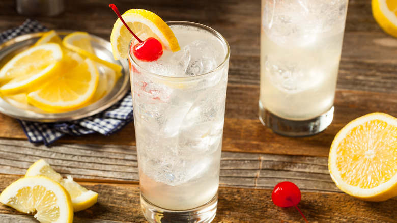 Refreshing Classic Tom Collins Cocktail with a Cherry and Lemon Slice