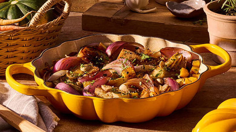 The Signature Pumpkin Braiser with the lid off showing braised vegetables.