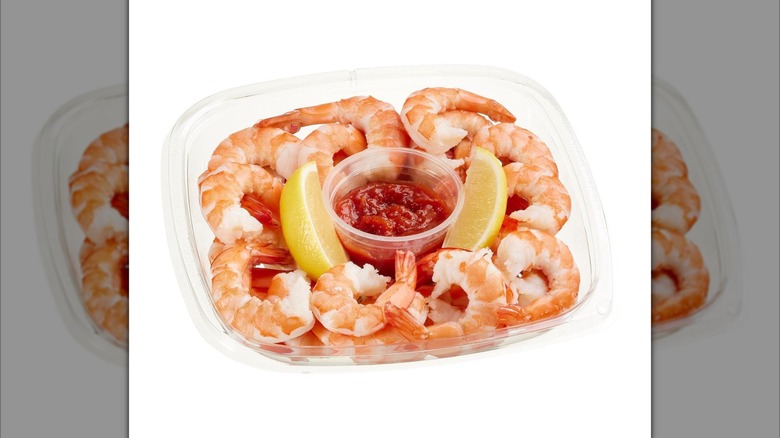 Tray of Kirkland Signature Shrimp Cocktail with lemon wedges and cup of cocktail sauce