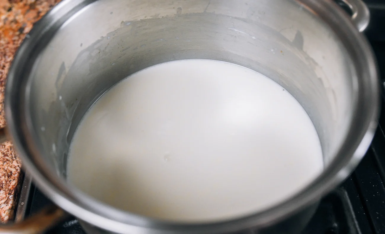 milk pudding mixture in stainless steel pot