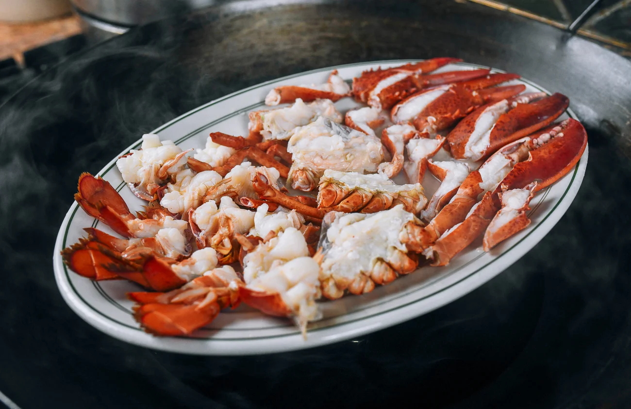 platter of steamed lobster in wok