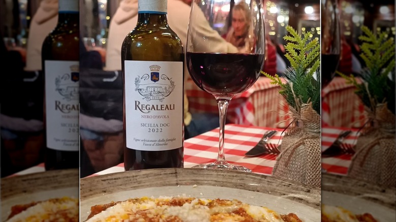 bottle and glass of red wine