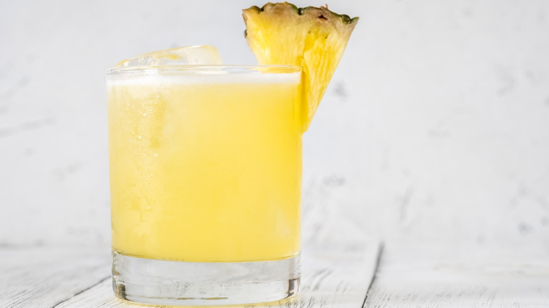 Pineapple coconut drink with pineapple wedge