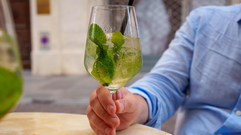 Person holding mint spritz
