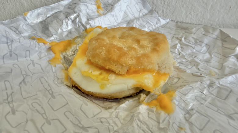 Messy Egg & Cheese Biscuit on a wrapper