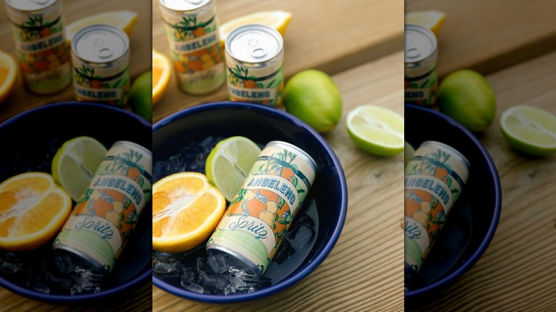 Can of Angeleno Spritz in blue bowl of ice and citrus