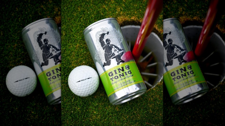 Greenhook Ginsmiths Gin and Tonic next to golf boll on golf hole