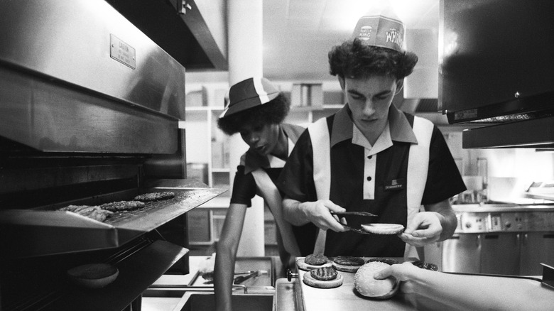 workers cooking on a grill