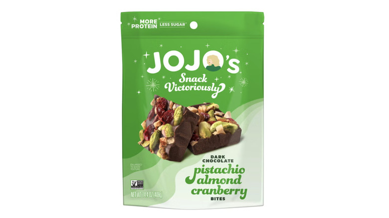 A close-up of a Jojo's Pistachio Almond Cranberry Bites packet.