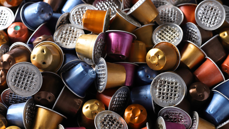 Pile of colorful, used Nespresso capsules