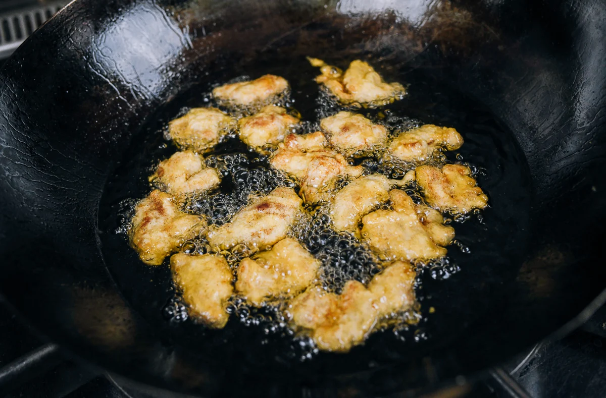 frying chicken pieces for sesame chicken