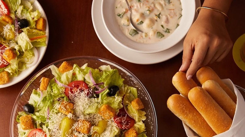 A table with an Olive Garden Soup, Salad, and Sticks