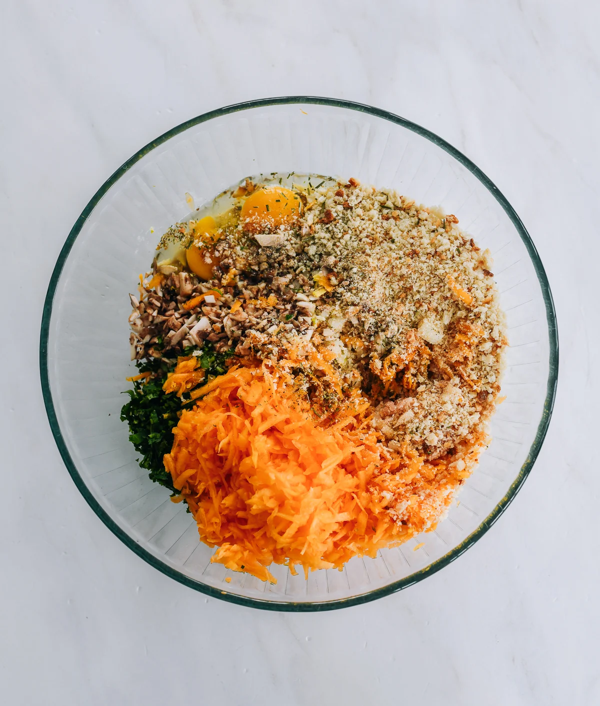 chicken meatball ingredients in glass bowl