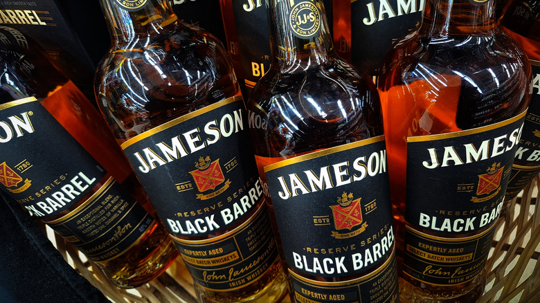 Several bottles of Jameson Black Barrel placed in a basket