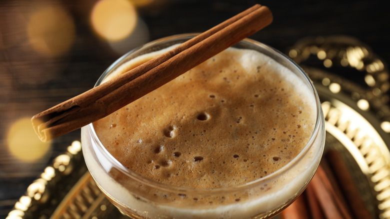 Espresso martini garnished with a cinnamon stick