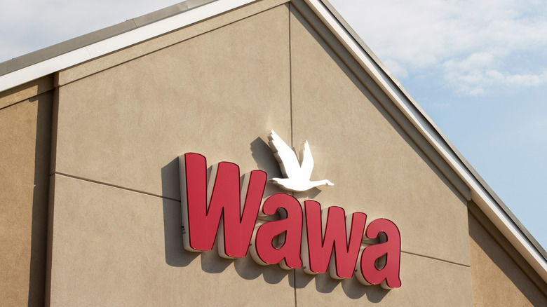 Tan Building with Red Wawa Sign and White Bird Logo
