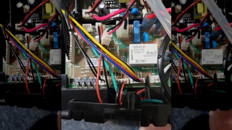 The inside wires and motherboard of a Keurig coffee machine