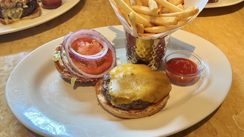 Cheesecake Factory Old Fashioned Burger and fries on plate.