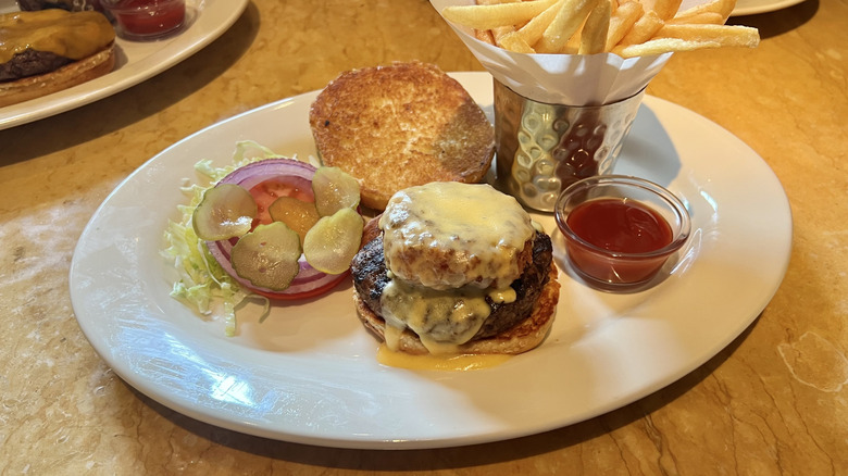 Cheesecake Factory Macaroni and Cheese Cheeseburger and fries on plate.