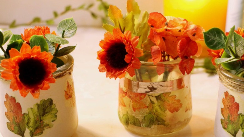 Decoupaged glass jars with flowers