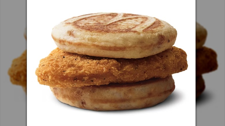 A McDonald's Chicken McGriddle sitting on a white background.