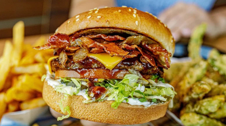 Habit BBQ Bacon Char Burger surrounded by sides