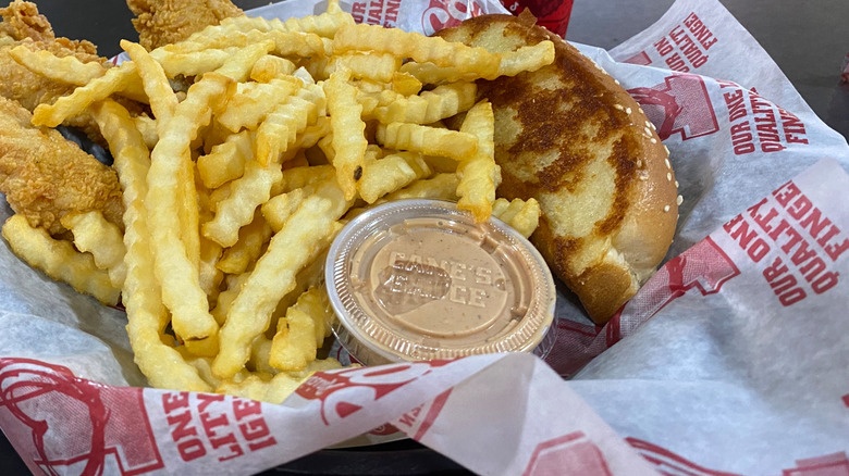 View of Raising Cane's Cane's Sauce with fries