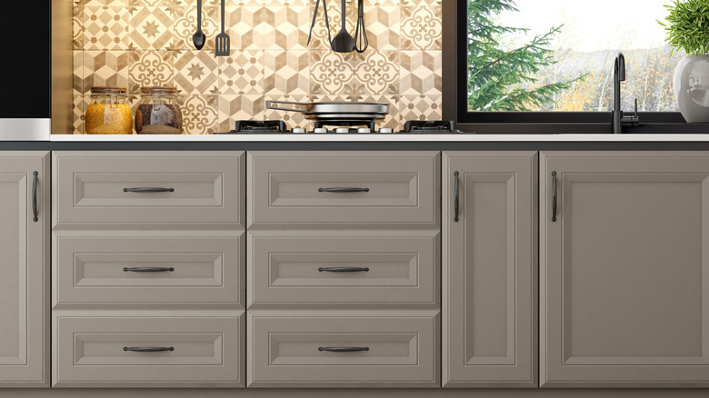 View of greige kitchen cabinets