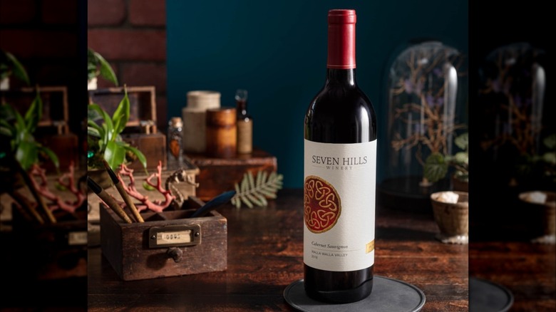 bottle of Seven Hills Winery red wine on a table