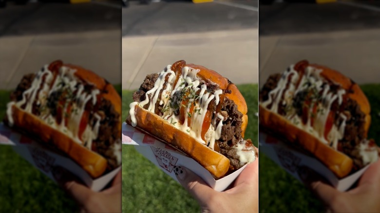 Hand holding Bulgogi cheesecake sandwich
