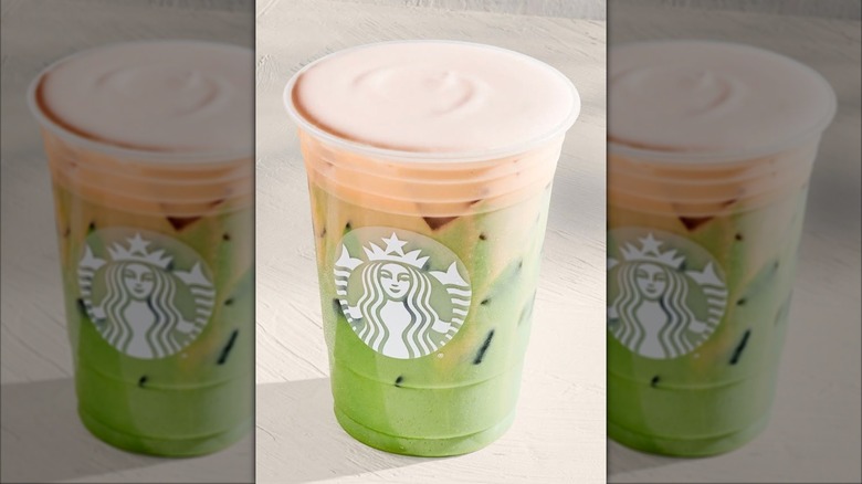 Starbucks Iced Orange Cream Matcha in logo cup