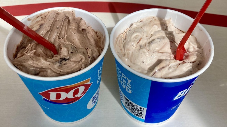 Two types of Dairy Queen Blizzards side by side with spoons sticking out of them