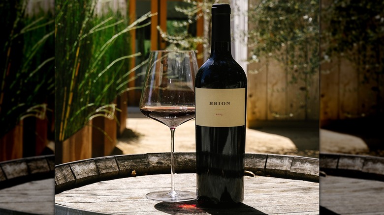 Bottle of BRION 2023 white label cabernet sauvignon and glass